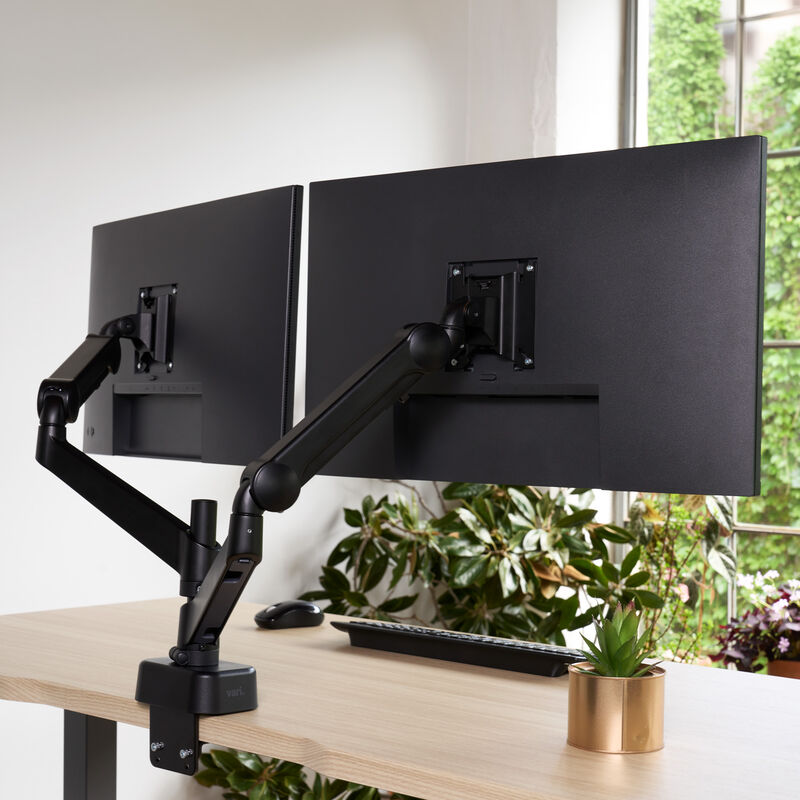 view from the back of the dual monitor arms installed on a desk with monitors on  image number null