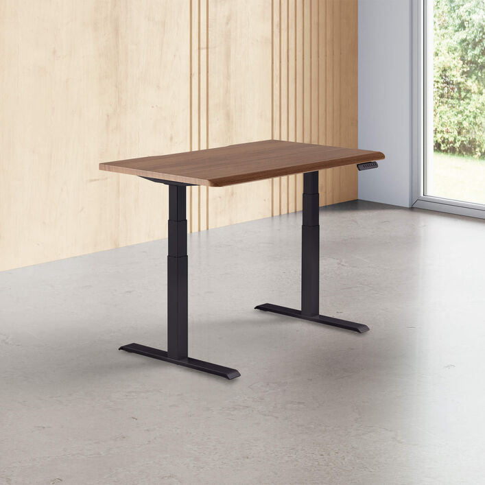 walnut finish standing desk top with black legs in a open office image number 0