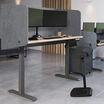 tall privacy desk surround in light grey felt on an electric standing desk