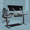 Sit stand executive workspace bundle comprised of electric standing desk 72 by 30, standing mat 36 by 24, dual monitor arm, power hub, cable tray and task chair with headrest. 