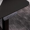 close up of essential electric standing desk in black finish