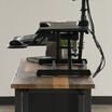 side view of a electric desk converter on top of a table