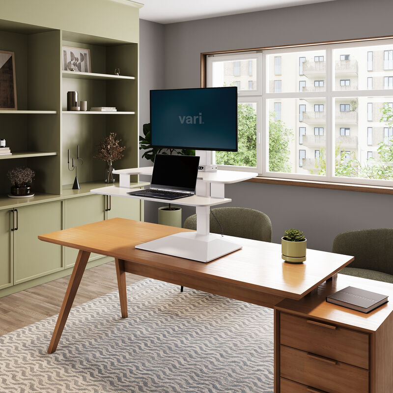 varidesk electric single monitor converter in white in a raised position on desk  image number null