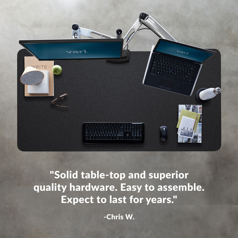 Overhead view of standing desk with a quote at the bottom of the image saying "Solid table-top and superior quality hardware. Easy to assemble. Expect to last for years image number null