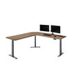 overview image of walnut l shape with monitor on desk