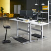 two electric standing desks 60x30 discontinued in white with silver legs at an office