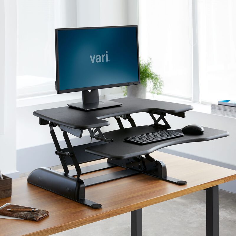 VariDesk Pro Plus 30 Black sit-stand desk converter in raised position in office  image number null