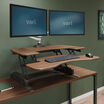 varidesk pro plus 36 walnut sit-stand desk converter in raised position at home office