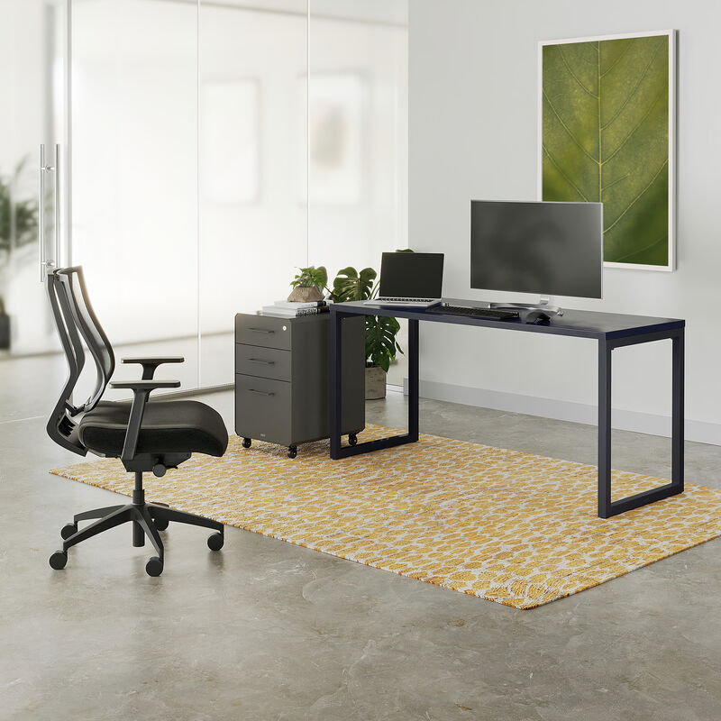 black top and black leg table in an open office image number null