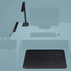 workspace setup with a standing mat a lamp and 8 ft power strip