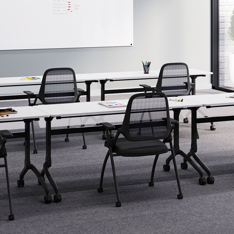 vari flip top training table five foot in white, nesting training chair, and flip top training table modesty panel five foot setup in an office training room. image number null