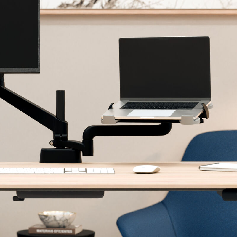 laptop sitting on top of the laptop holder installed on a desk image number null
