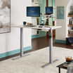 Electric Standing Desk 60x30 White in raised position at home