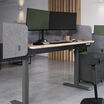 desk surround attached to a standing desk in an open office