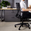 professional working in office of vari products, including lateral file cabinet