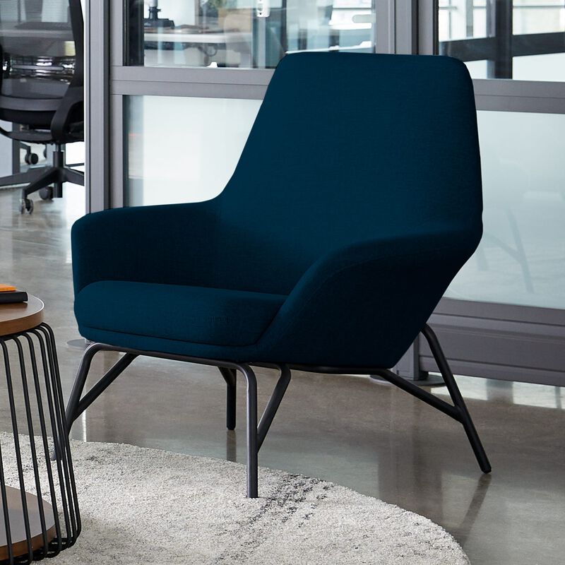 navy arm chair in office setting image number null