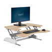 varidesk pro plus 36 light wood sit-stand desk converter in raised position