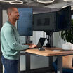 vari triple monitor arm setup on the electric standing desk with comfort edge