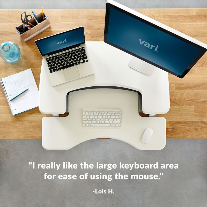 Overhead view of converter with a customer quote at the bottom of the image that reads, I really like the large keyboard area for ease of using the mouse. image number null