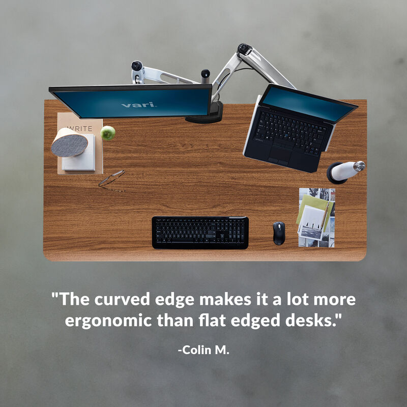 Overhead view of standing desk with a quote at the bottom of the image saying "Solid table-top and superior quality hardware. Easy to assemble. Expect to last for years." image number null