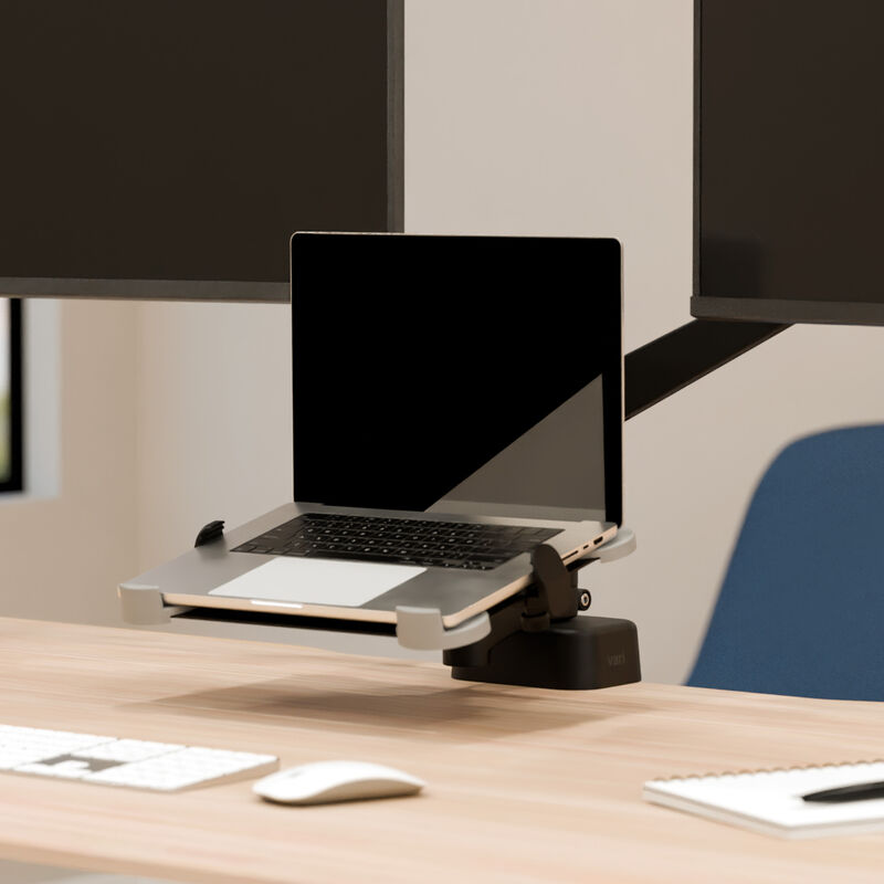 laptop sitting on top of the laptop holder installed on a desk image number null