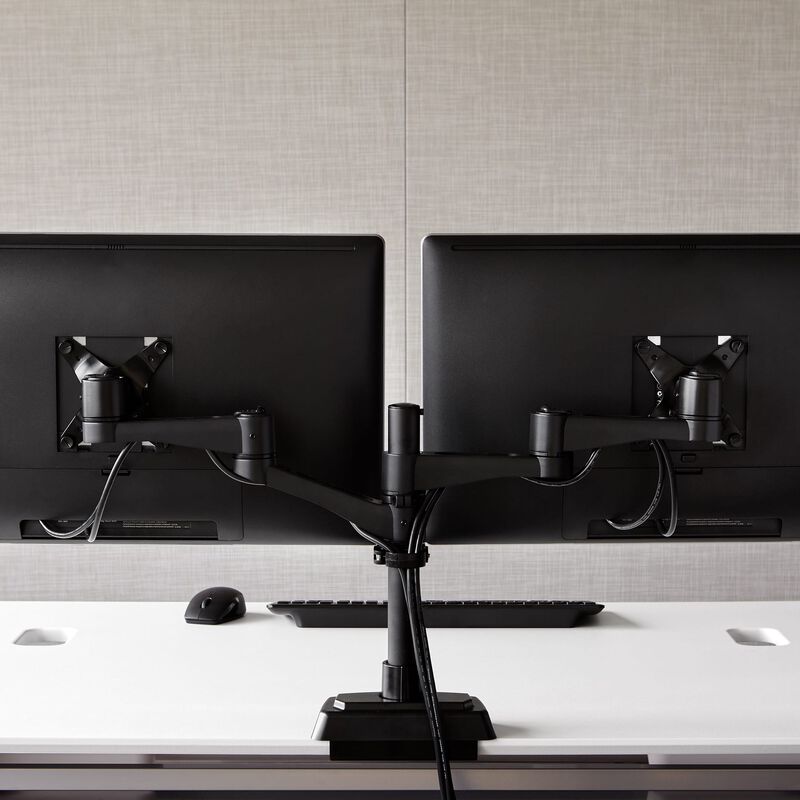 Dual-Monitor Arm 180° Black mounted to desk with two monitors installed image number null