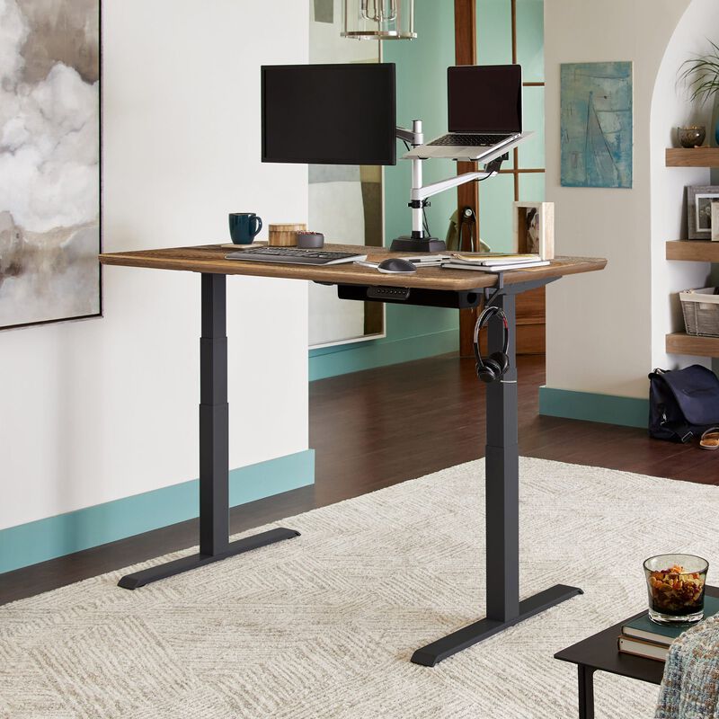 Electric Standing Desk 60x30 in reclaimed wood finish in raised position in an home office setting. image number null