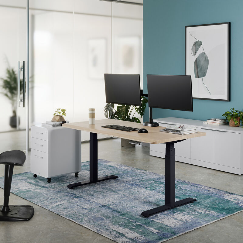 Electric Standing Desk 60x30 light wood in lowered position at home image number null