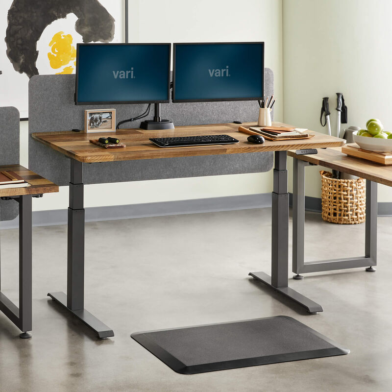 Privacy and Modesty Felt Panel 60 in Light Gray Felt mounted on a desk in an office setting image number null