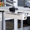Cable Management Tray in White attached to the Vari Electric Standing Desk in office