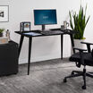 black essential desk 48 by 24 4 leg in office setting