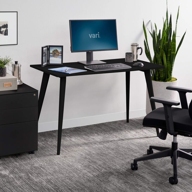 black essential desk 48 by 24 4 leg in office setting image number null