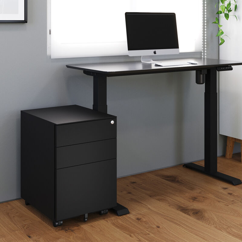 black file cabinet sitting next to a raised standing desk in a home office image number null
