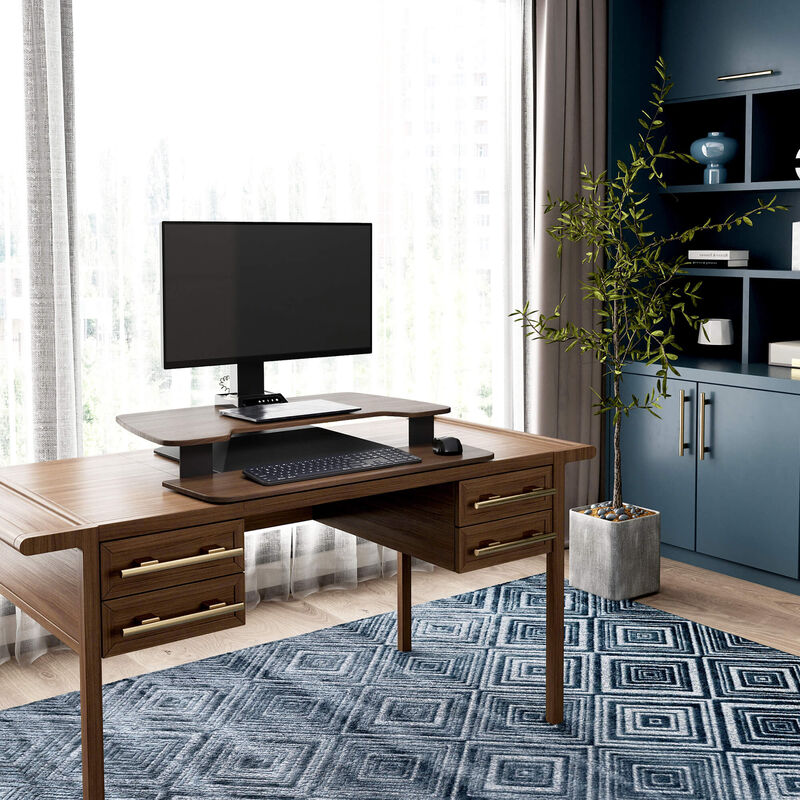 varidesk electric single monitor converter in walnut in a lowered position on desk  image number null