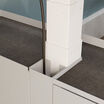 close up of cord management on standing desk cubbies