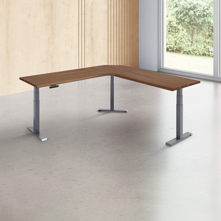 L-shape desk with a walnut finish desk top with slate legs in a open office image number 0
