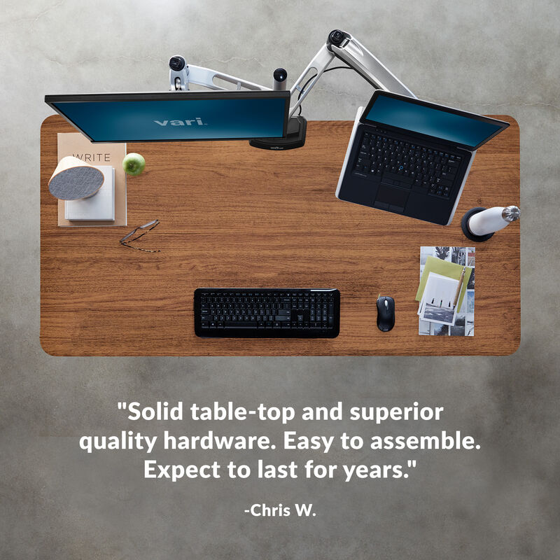 Overhead view of standing desk with a quote at the bottom of the image saying "Solid table-top and superior quality hardware. Easy to assemble. Expect to last for years image number null