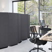 privacy screen with expansion panel in steel grey used in an open office setting