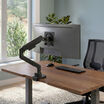 showing back side of ultra wide monitor arm with monitor attached