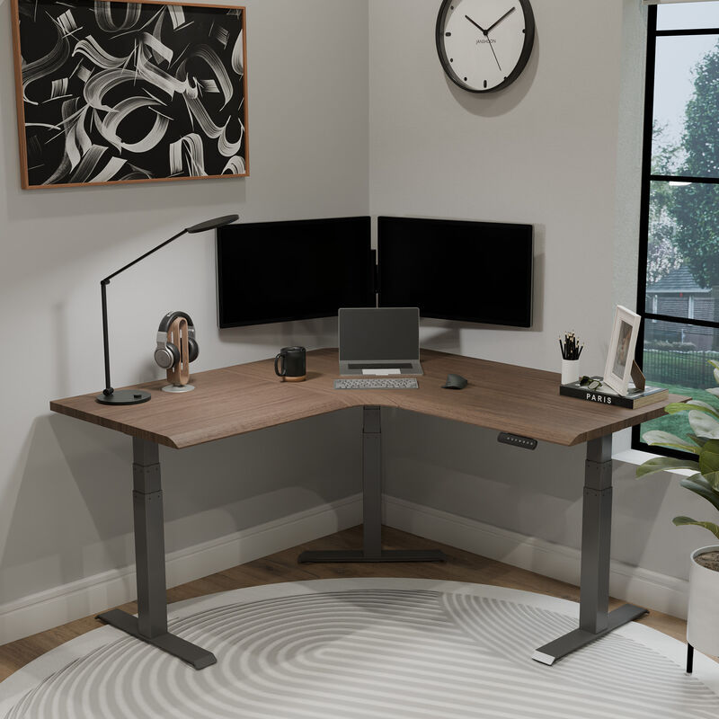 walnut finish l shape electric standing desk in a lowered position in the corner of a workspace image number null