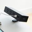 front view of black powerhub installed on desk