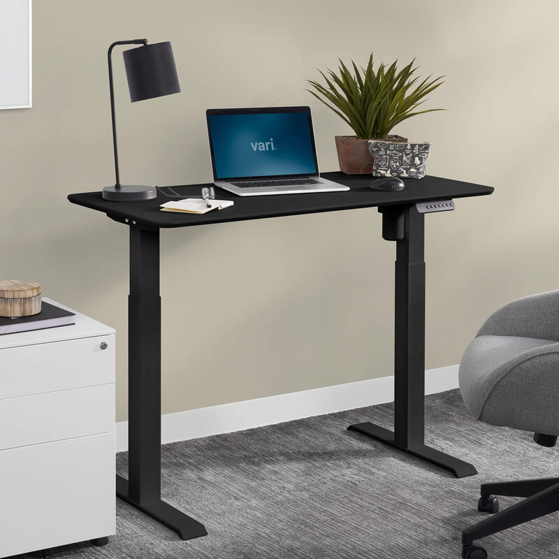 vari essential electric standing desk in office setting image number null