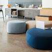 small light blue ottoman in lounge setting