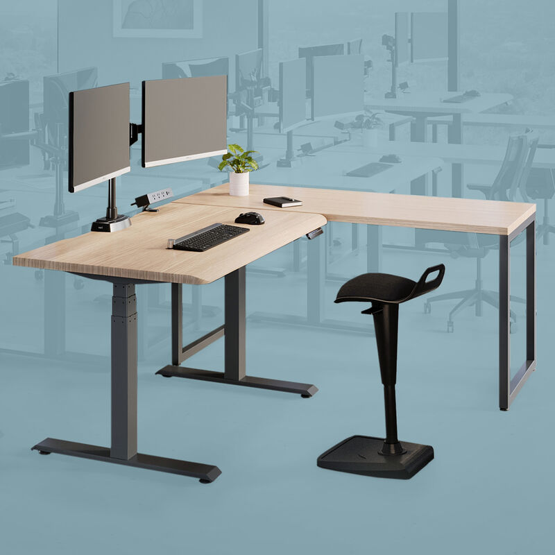 Remote pro bundle setup includes an electric standing desk a table and dual monitor arms with an active seat and power hub image number null