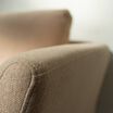 close up view of the contemporary three-seat sofa in sandstone to show the polyester fabric