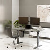 driftwood top finish with slate legs in seated position in open office