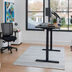 Electric Standing Desk 60x30 black in raised position at home