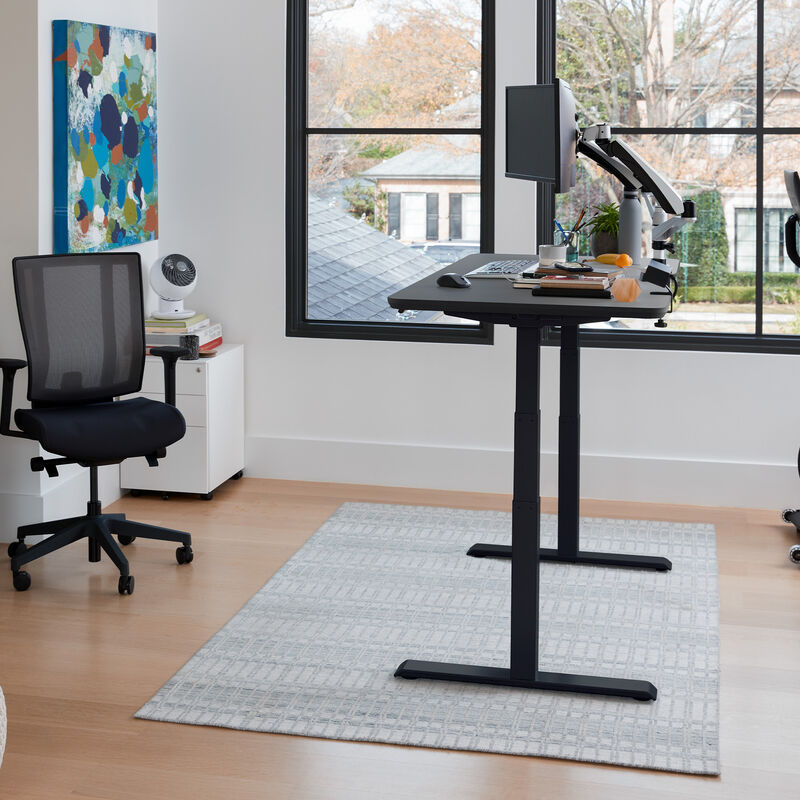 Electric Standing Desk 60x30 black top with black legs in raised position at home image number null