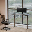 black finish standing desk in an office setting