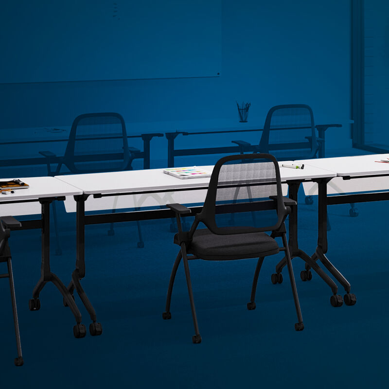 vari flip top training table five foot in white, nesting training chair, and flip top training table modesty panel five foot setup in an office training room with a blue overlay. image number null